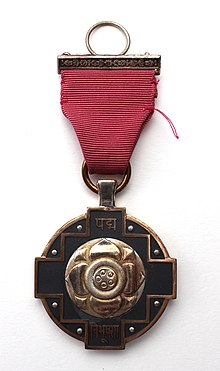 Padma Vibhushan medal in golden colour with its pink ribbon