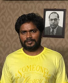 Pa. Ranjith in home infront of a photo