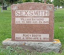 Red stone marker inscribed with Sexsmith's name