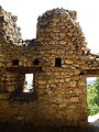 Interior View with entrance (right) and timber holes for floor, located above window