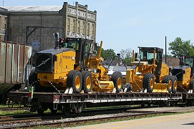 CN flatcar with newly built Road-Graders.
