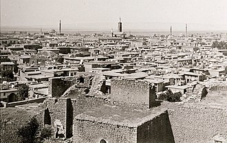 Black-and-white view of roofs in a city