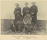 Team photograph of a rifle shooting team, in black and white.