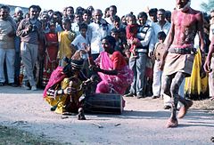 A hijra in a traditional village performance