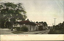 A postcard showing a small railway station