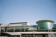 An airport terminal with a large "Terminal 2" sign on it