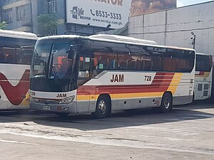 A JAM Liner bus wearing red-yellow livery after took over by JAC Liner.