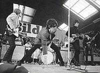 The Rolling Stones band playing on stage
