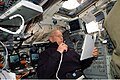 Patrick Forrester talks to ground controllers while on the aft flight deck of Atlantis