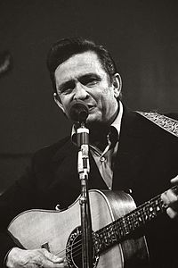 Country-western singer Johnny Cash called himself "the man in black". Image of his performance in San Quentin, in 1969.