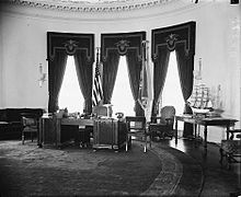 a black and white image of the Hoover desk in the oval office.