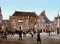 In this photograph from c.1900 the tower is gone, the stairs have their railing, the balcony is gone, and on the right a large clock can be seen that served until after WWII.