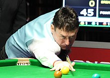 Jimmy White playing snooker