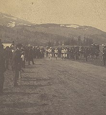 Spectators watch on at the annual Independence Day (United States) foot race in Alma, Colorado, 1800s.
