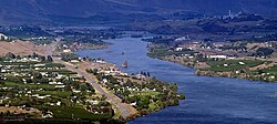 View of Rock Island, looking east up the Columbia River towards the Great Northern Railway bridge