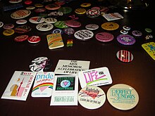 An image of an array of LGBTQIA+ buttons of varying sizes and colour.