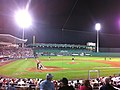 The Red Sox play a spring training game against the Yankees at night