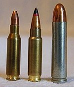 Photo of the 5.7×28mm cartridge next to the similarly-sized 4.6×30mm and .30 carbine cartridges