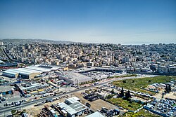 Al-Ram behind the separation barrier