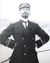 An imperious young man in Greek naval uniform