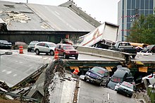 Perhaps a dozen vehicles in view of the wreckage