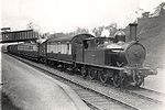 London & North Western Railway 2-4-2 steam locomotive pulling a passenger train in the late 1910s