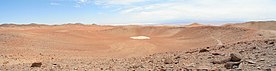 The crater is the depression at the centre of the image