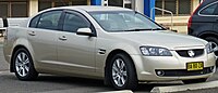 Front-three-quarters view of a gold-coloured sedan