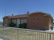 The Old Rittenhouse Elementary School, located on the S.E. corner of Ellsworth and Queen Creek roads was built in 1925. Used as a school through 1982, this building now houses the San Tan Historical Society. Listed in the National Register of Historic Places in 1998. Reference 98000053