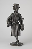Figure B: Albrecht of Bavaria (d. 1404) holding a staff. He wears a fur hat and a houppelande with fur trimmings.[26]
