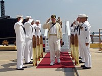 President Jimmy Carter salutes the sideboys after departing the USS Jimmy Carter (SSN-23)