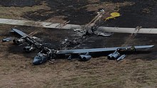 Remains of a burned down B-52H bomber at Anderson Air Force Base