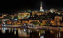 Belgrade at night, reflected in a river