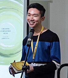 Jerrold Yam reading at the Singapore Writers Festival.