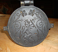 19th century krumkake iron decorated with national coat of arms