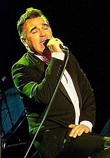 A man singing on stage