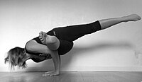 Eka Pada Koundinyasana I (lower leg on arm)