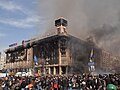 Image 9 Burning of the Trade Unions Building Photograph: Amakuha The burning of the Trade Unions Building—used as the headquarters of the Euromaidan movement—during the 2014 Ukrainian revolution, following a failed attempt by the Ukrainian police to capture the building. After the fire, the damaged building was covered with large canvas screens on two sides with the words "Glory to Ukraine" printed on them in large letters. More selected pictures