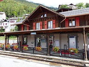 Two-story wooden building with gabled roof