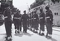 Major General David Cowan, General Officer Commanding BRINDIV, inspects Indian troops at Kure, 30 March 1946.