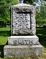 Paul and Lydia Smith's gravestone at nearby St. John's in the Wilderness Episcopal Church. He donated the land on which the church stands.