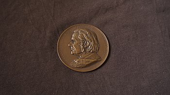 The Huxley memorial medallion in bronze created by Frank Boucher