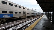 A Metra Train, with the closest two cars being Budd and the rear two being Nippon Sharyo.