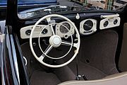 This 1951 Volkswagen convertible dashboard is non-standard, and I like it. I can identify every gauge except the one on the far right.