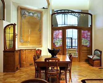 Dining room furniture and wall panel by Horta from the Hôtel Aubecq (1902–1904)