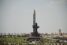 A towering monument resembling a bayonet