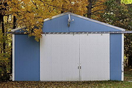 Blue garage and autumn foliage in McGregor, Minnesota