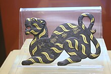 Badge of black tiger with golden stripes