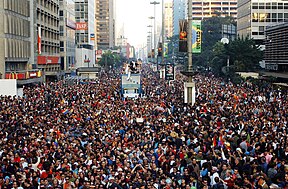 Looking down from building at parade in São Paulo, Brazil