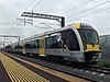 AM 103 at Puhinui station on its first test run in October 2013